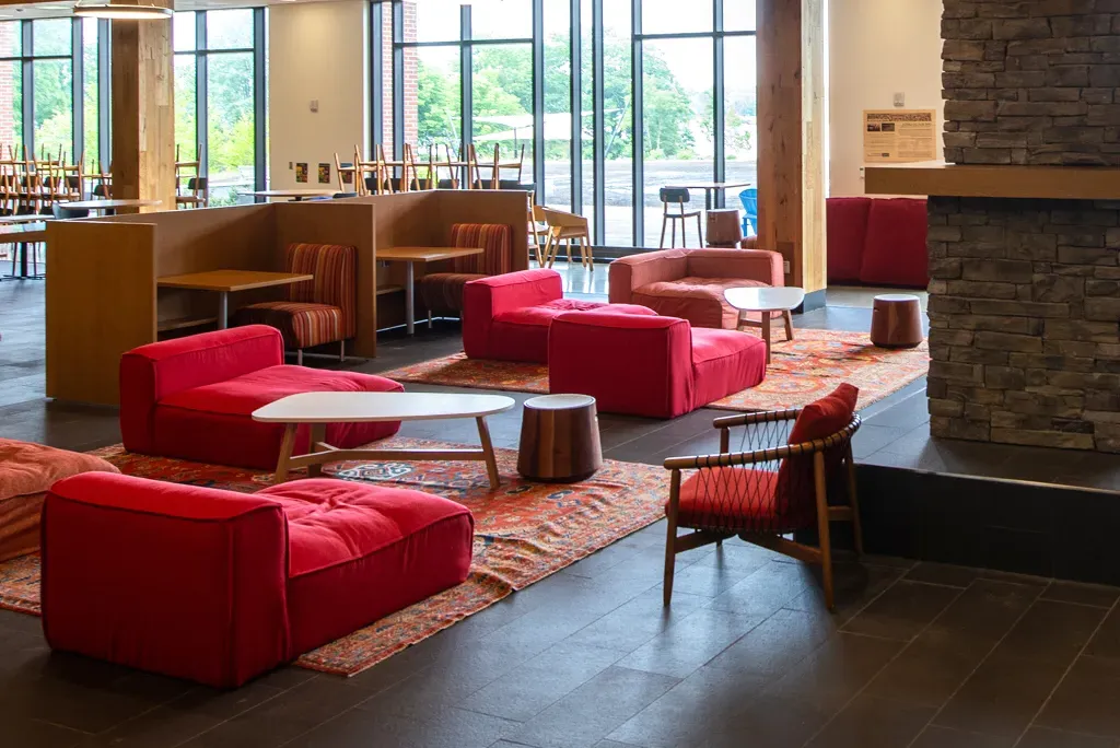 red lounge chairs on the first floor of the Ripich Commons